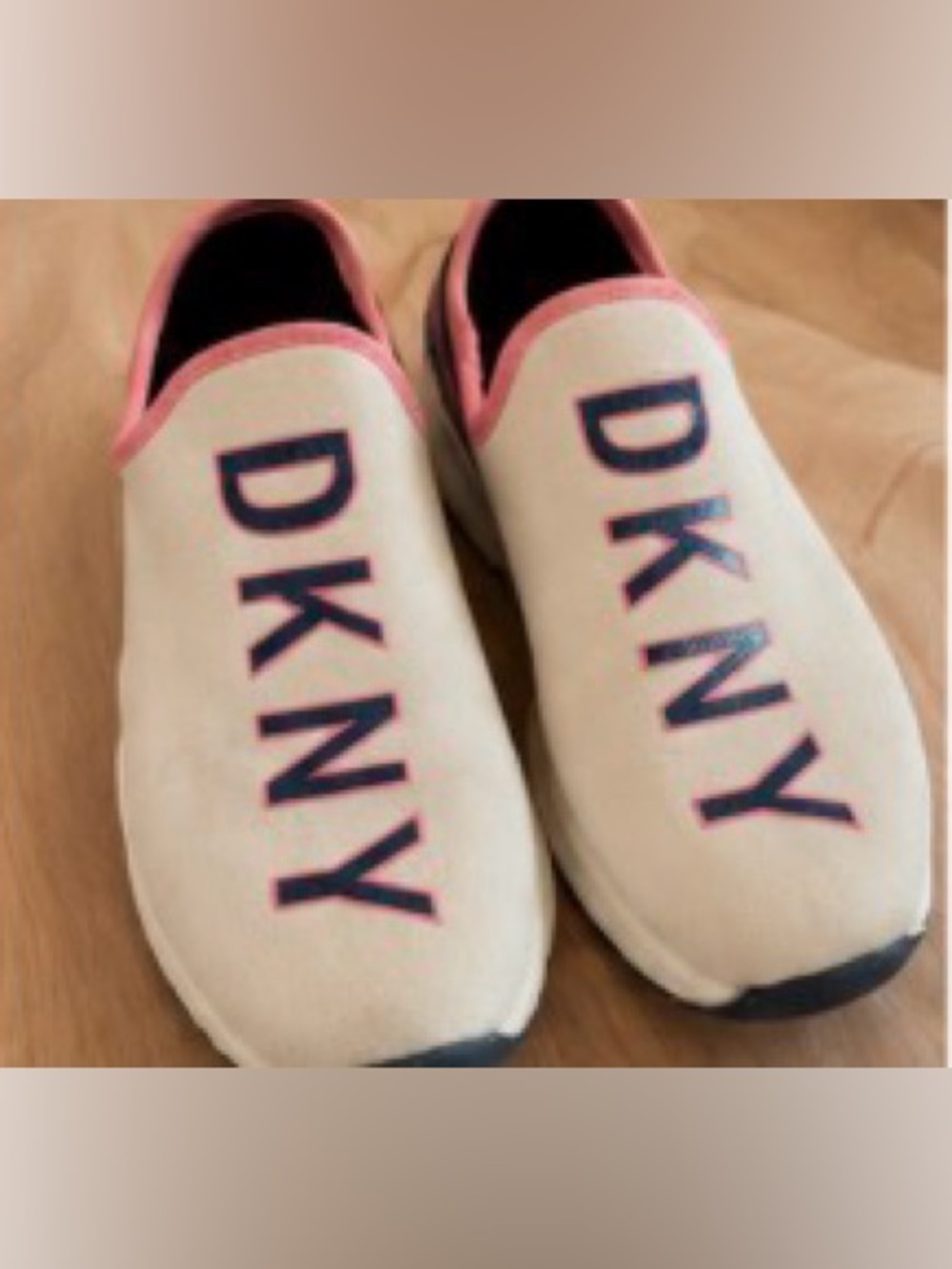 DKNY Slip On Sneakers DKNY Logo. Women’s Size 7?? Measures 9 3/4 toe to heel.